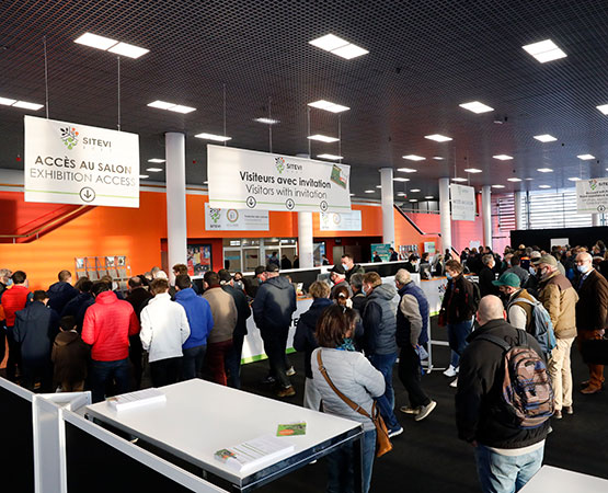 Visitors waiting at the exhibition reception desk